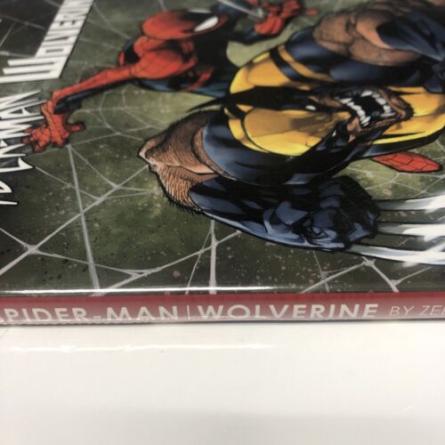 Spiderman-Man | Wolverine (2019) HC • Marvel Universe • Zeb Wells •Joe Madureira